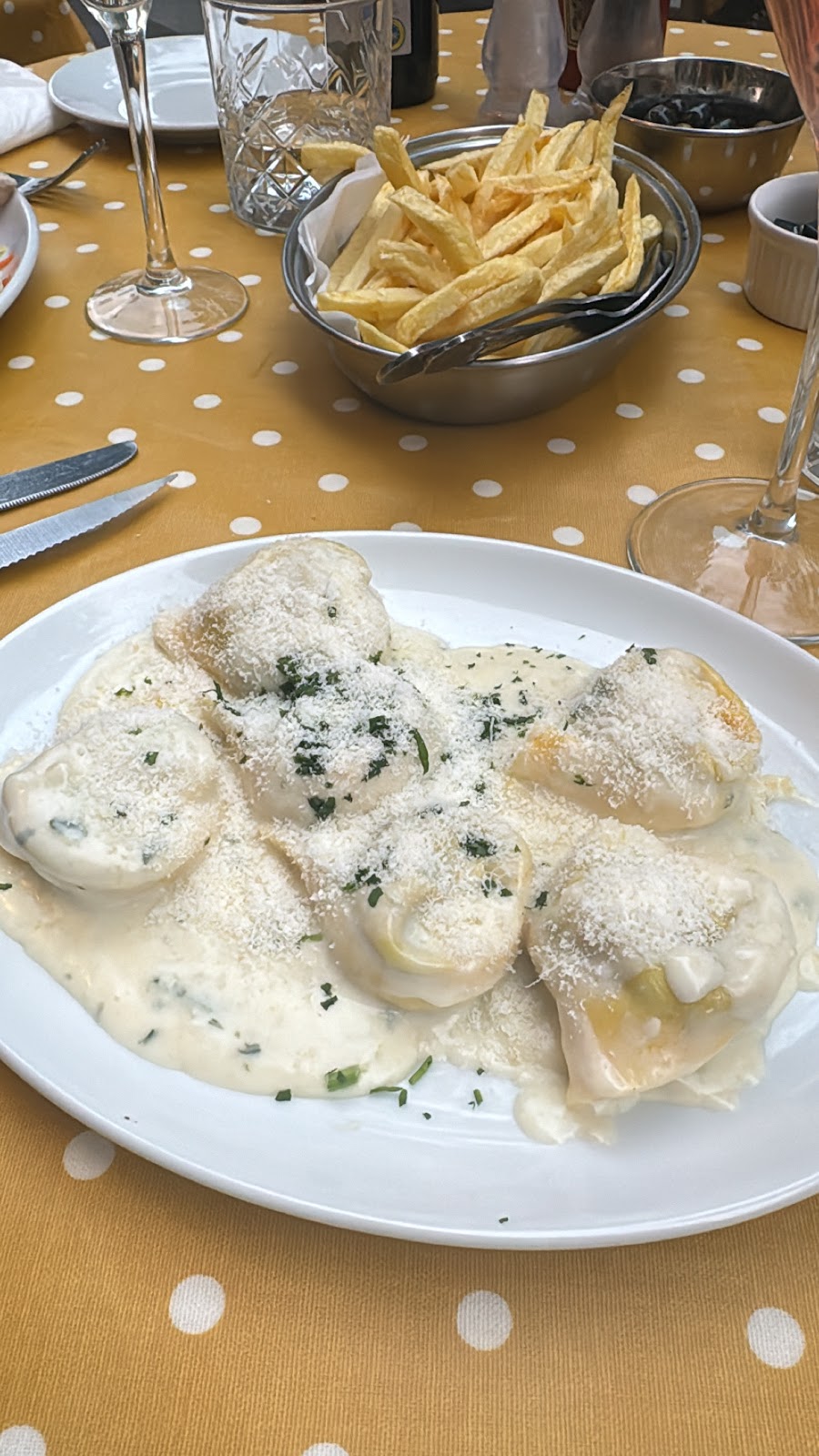 Ravioli in cream sauce with grated cheese at Anacapri