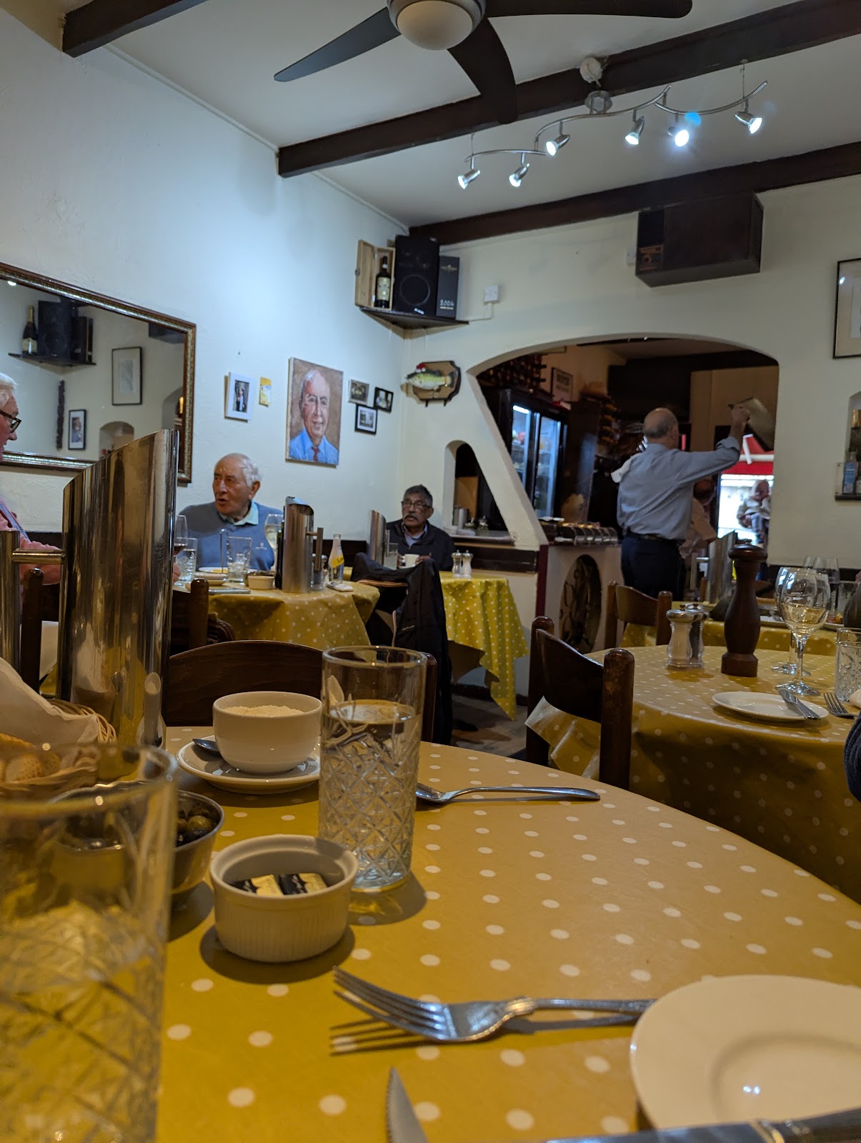 Yellow-cloth tables inside Anacapri